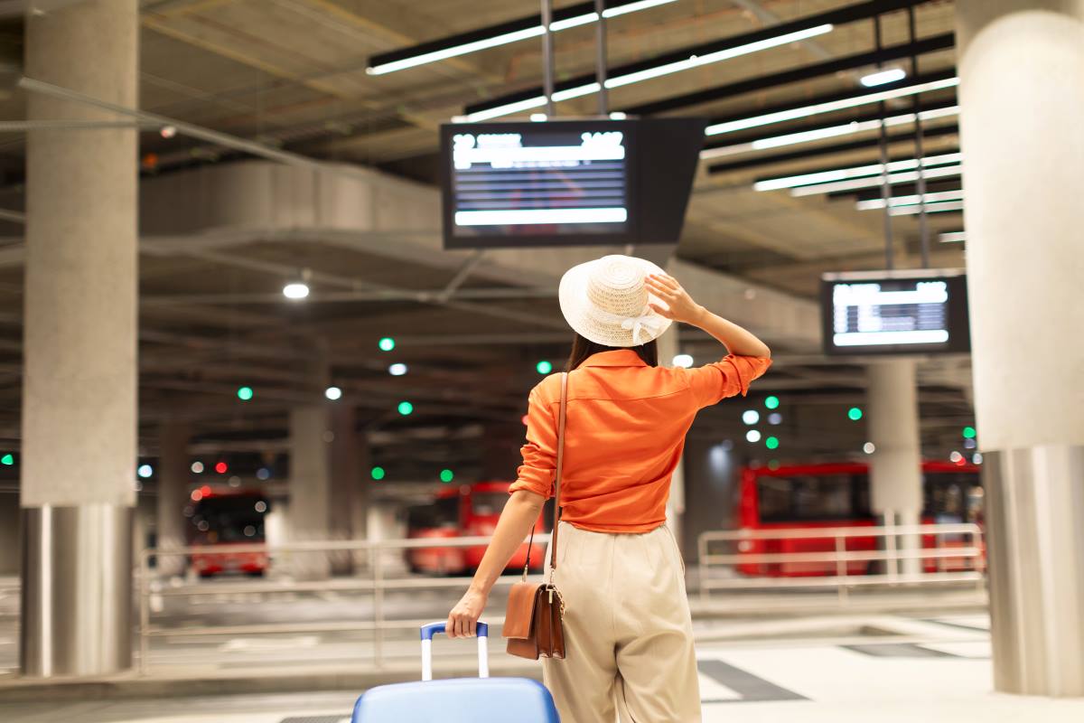 back view of passenger woman standing