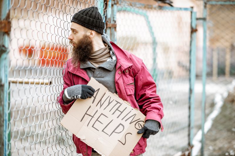 beggar with helping board