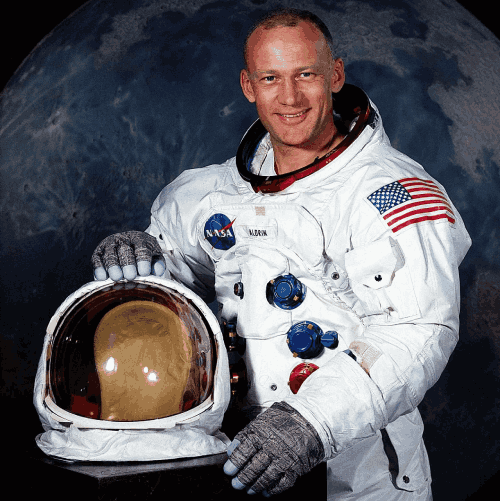 buzz aldrin posing in astronaut suite