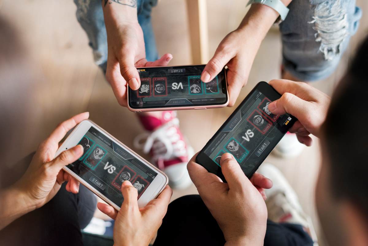 group of friends gaming in mobile