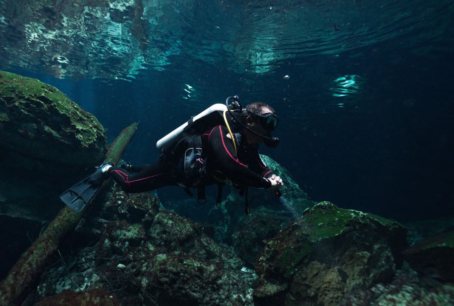 scuba diver exploring alone 