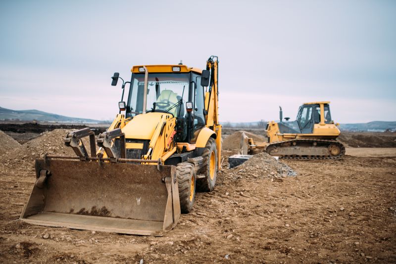 bulldozers parked at construction site