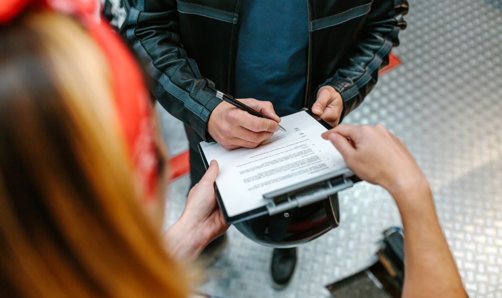 bike rider filling form of  insurance